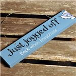 Order Just jogged off door sign